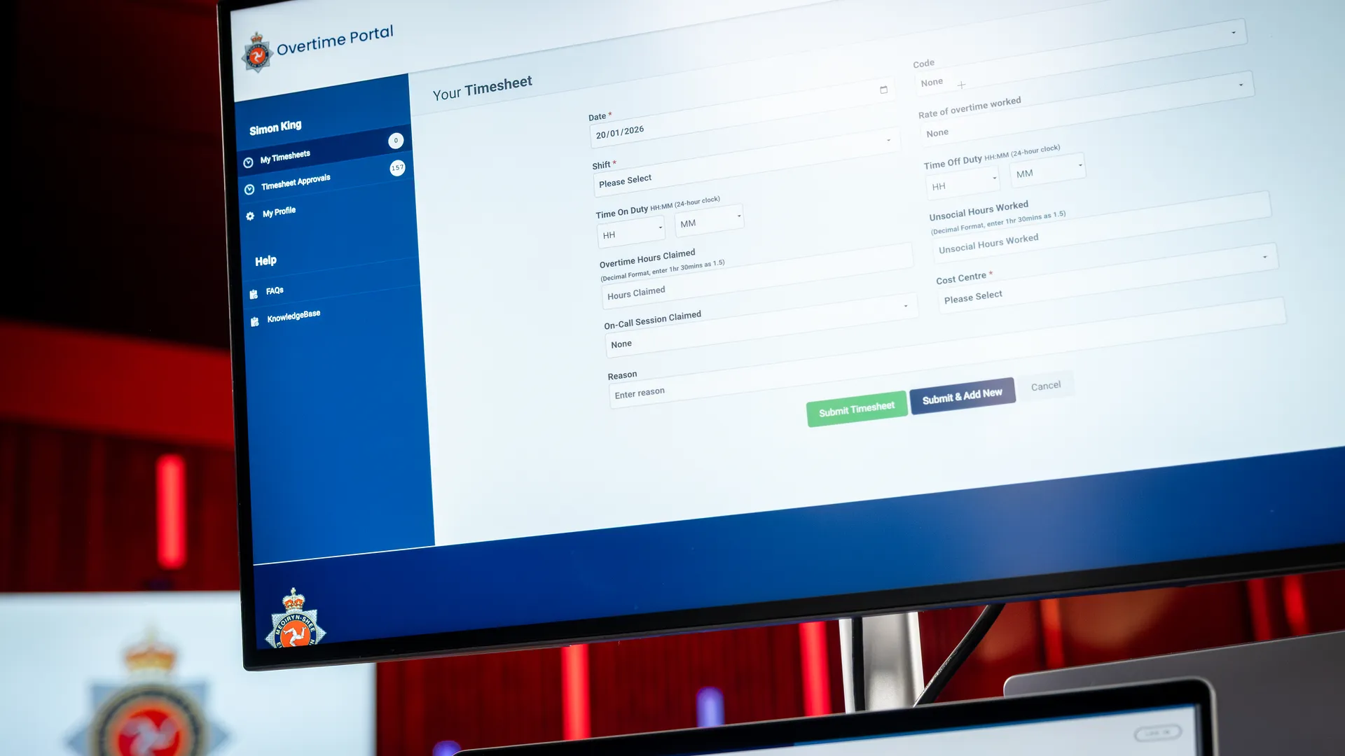 Isle of Man Constabulary overtime portal timesheet screen displayed on a desktop monitor, developed by DotPerformance